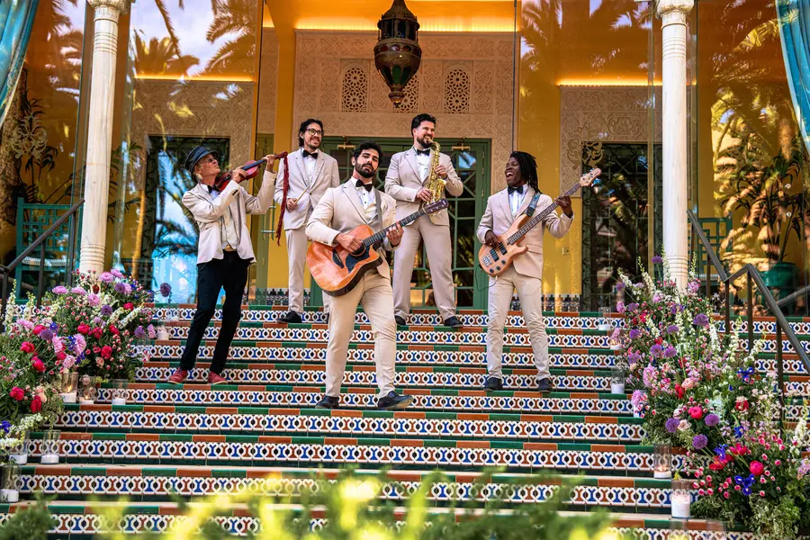 Band performing on decorated steps at an Algarve wedding