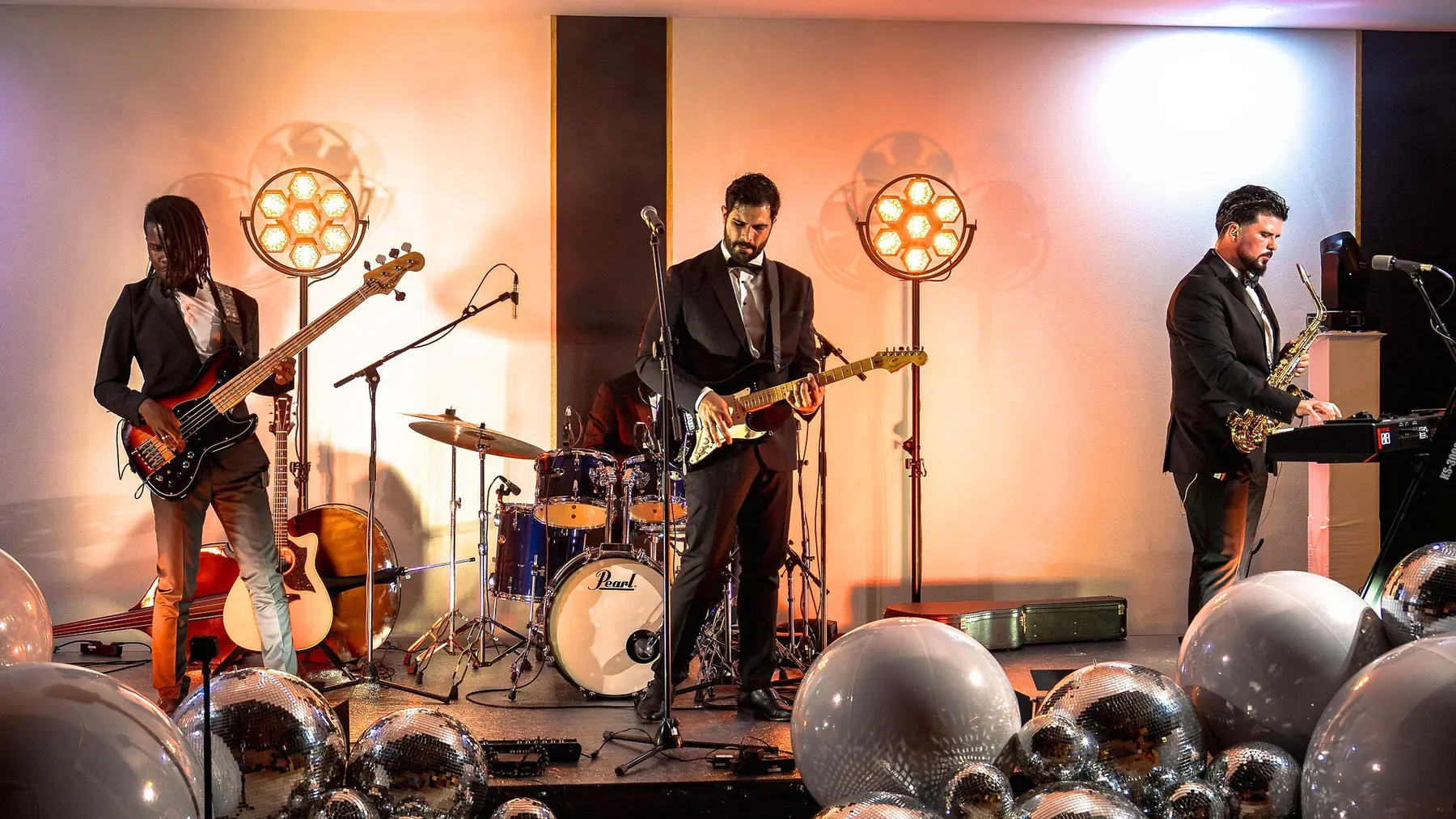 The Keys Stage Band on stage with retro lighting
