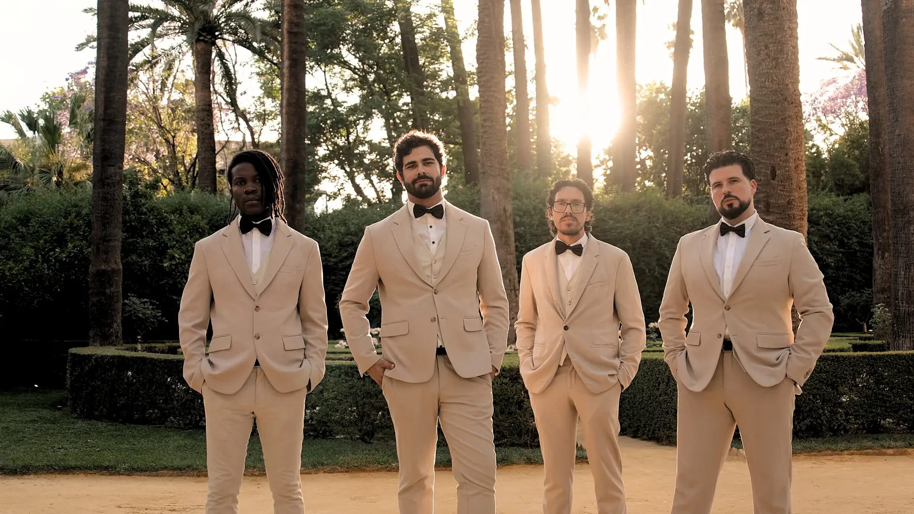 The Keys musicians standing in a garden