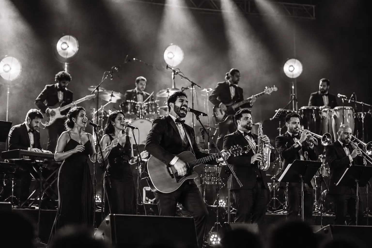 The Keys Orchestra on stage with brass, percussion and two lead vocals